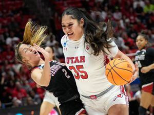 (Francisco Kjolseth | The Salt Lake Tribune) Utah Utes forward Alissa Pili (35) collides with Gardner-Webb Runnin' Bulldogs guard Lauren Bevis (2) as she dives the ball to the basket of a first-round college basketball game in the NCAA Tournament, Friday, March 17, 2023, in Salt Lake City, Utah.