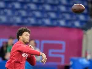 BYU quarterback Jaren Hall warms up before he runs a drill at the NFL football scouting combine in Indianapolis, Saturday, March 4, 2023. (AP Photo/Michael Conroy)