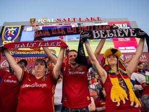 (Trent Nelson  |  The Salt Lake Tribune) Real Salt Lake fans raise scarves for a corner kick as RSL faces Columbus Crew, MLS soccer in Sandy on Saturday, June 25, 2022.
