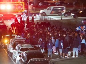 (Francisco Kjolseth | The Salt Lake Tribune) More that a hundred people gather at the candlelight vigil of Hunter High football players Paul Tahi , 15, Tivani Lopati, 14, and Ephraim Asiata, 15, on Friday, Jan 14, 2022, in West Valley City, near Hunter High School along 1400 South at Mountain View Corridor. Paul Tahi and Tivani Lopati were killed in a shooting, while Ephraim Asiata was critically wounded.