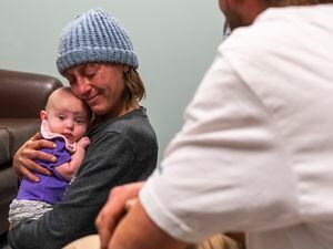 (Rick Egan | The Salt Lake Tribune) Bodhi and Jack King spend time with her daughter, Raya, during a supervised visit at the Division of Child and Family Services on Wednesday, Nov. 24, 2021. While homeless, the couple lost custody of Raya and spent years to improve their lives to be reunited.