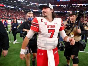 (Steve Marcus | AP) Utah quarterback Cameron Rising (7) walks across the field after Utah's 47-24 victory over Southern California in the Pac-12 Conference championship NCAA college football game Friday, Dec. 2, 2022, in Las Vegas.