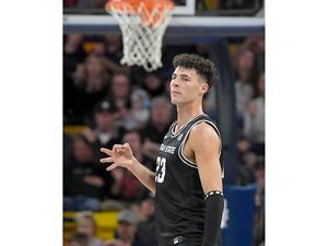 (Eli Lucero/The Herald Journal via AP) Utah State forward Taylor Funk (23) celebrates after making a 3-pointer against UNLV during the first half of an NCAA college basketball game Tuesday, Jan. 17, 2023, in Logan, Utah.