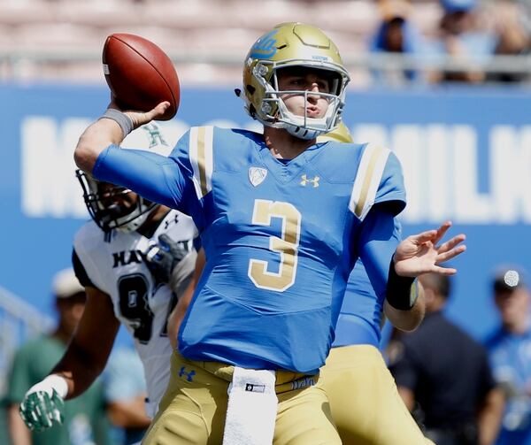UCLA quarterback Josh Rosen throws his first pass complete for 18 yards against Hawaii during the first half of an NCAA college football game in Pasadena, Calif., Saturday, Sept. 9, 2017. (AP Photo/Alex Gallardo)