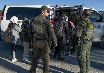 (Guillermo Arias | The New York Times) Asylum seekers and migrants board a Border Patrol vehicle in Boulevard, Calif., on Feb. 13, 2024. Here's what candidates in Utah's 2024 gubernatorial race think the role of the governor should be in immigration policy.