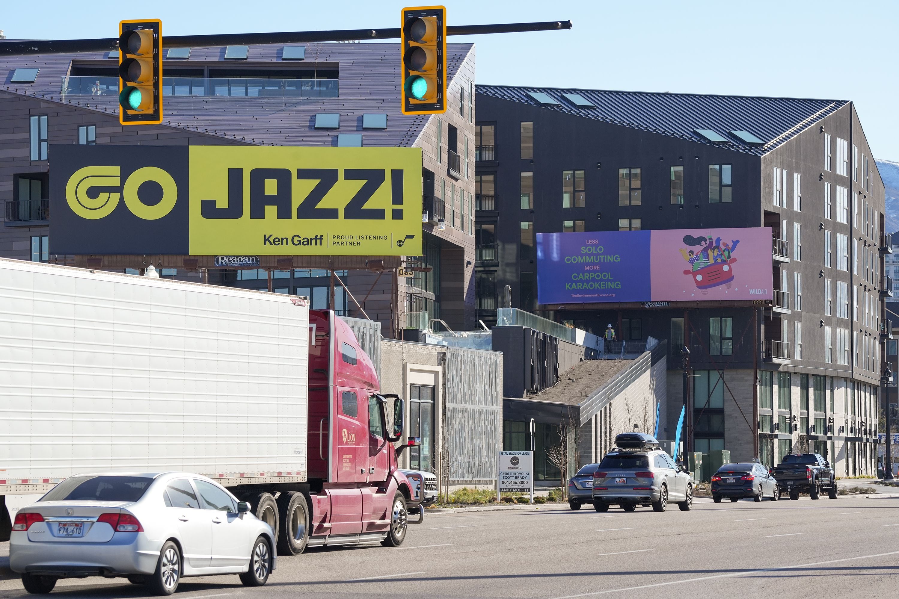 (Chris Samuels | The Salt Lake Tribune) A line of billboards in front of new apartment developments along 600 South in Salt Lake City, Monday, March 18, 2024.