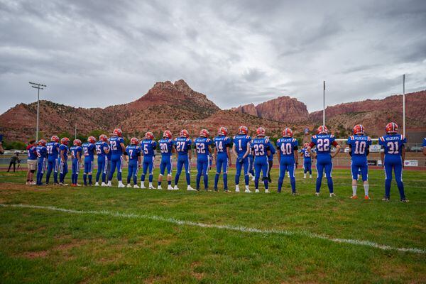 (Trent Nelson  |  The Salt Lake Tribune) Water Canyon High School football players prepare to face Grand County in their school's first football game, in Hildale on Friday, Aug. 12, 2022.