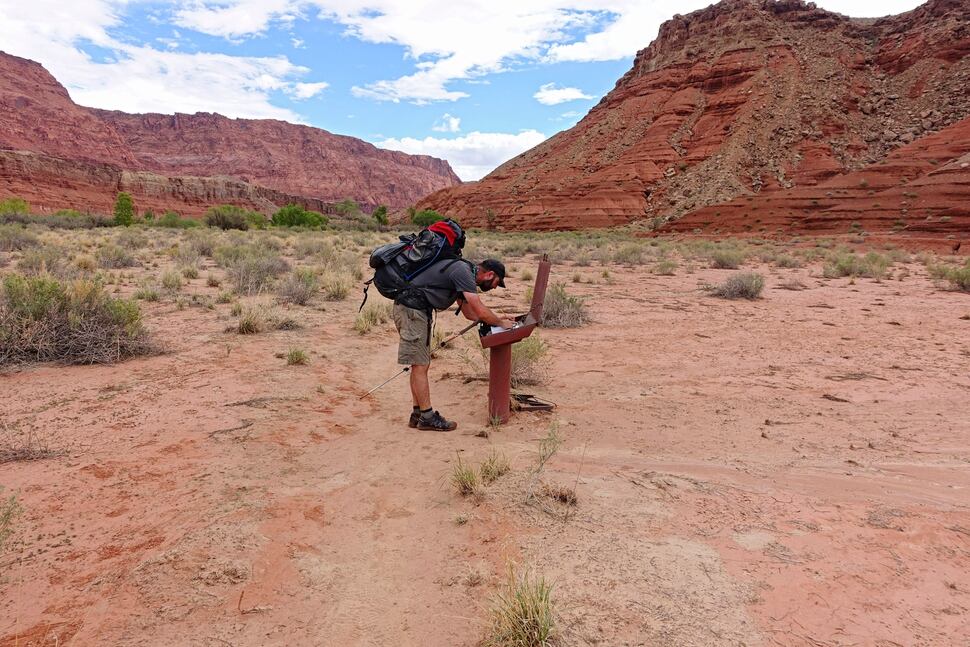 (Tribune File Photo) Peter Wagner signs a log book after hiking nearly 50 miles through Paria Canyon. Wednesday, Sept. 28, 2016.