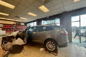 (SLCPD) A Buick Enclave crashed into a Famous Footwear in The Commons shopping center in Sugar House on the afternoon of Saturday, July 2, 2022, trapping a woman underneath it and injuring two others who were in the store — a woman who is 21 weeks pregnant and her 7-year-old daughter. Police believe the woman, 81, who was driving the SUV mistook the gas pedal for the brake.