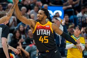 (Rick Egan | The Salt Lake Tribune) Utah Jazz guard Donovan Mitchell (45) high-fives his team after scoring 25 points in the 3rd quarter, in NBA action between the Utah Jazz and the Chicago Bulls, at Vivint Arena, on Wednesday, March 16, 2022.  