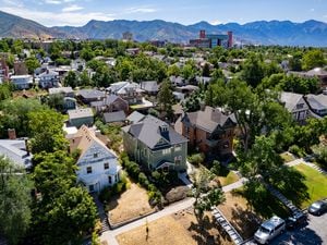 (Francisco Kjolseth | The Salt Lake Tribune) Houses are pictured west of the University of Utah on Tuesday, July 19, 2022. U. alumni are receiving requests to consider housing a student for $5,000 a semester. The "Home Away From Home" program is one way the U. is trying to make more housing available for students.