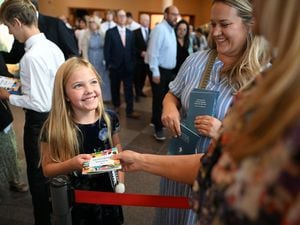 (The Church of Jesus Christ of Latter-day Saints)
Youngsters receive the new guide “For the Strength of Youth: A Guide for Making Choices” after the morning session of General Conference at the Conference Center in Salt Lake City on Oct. 1, 2022.