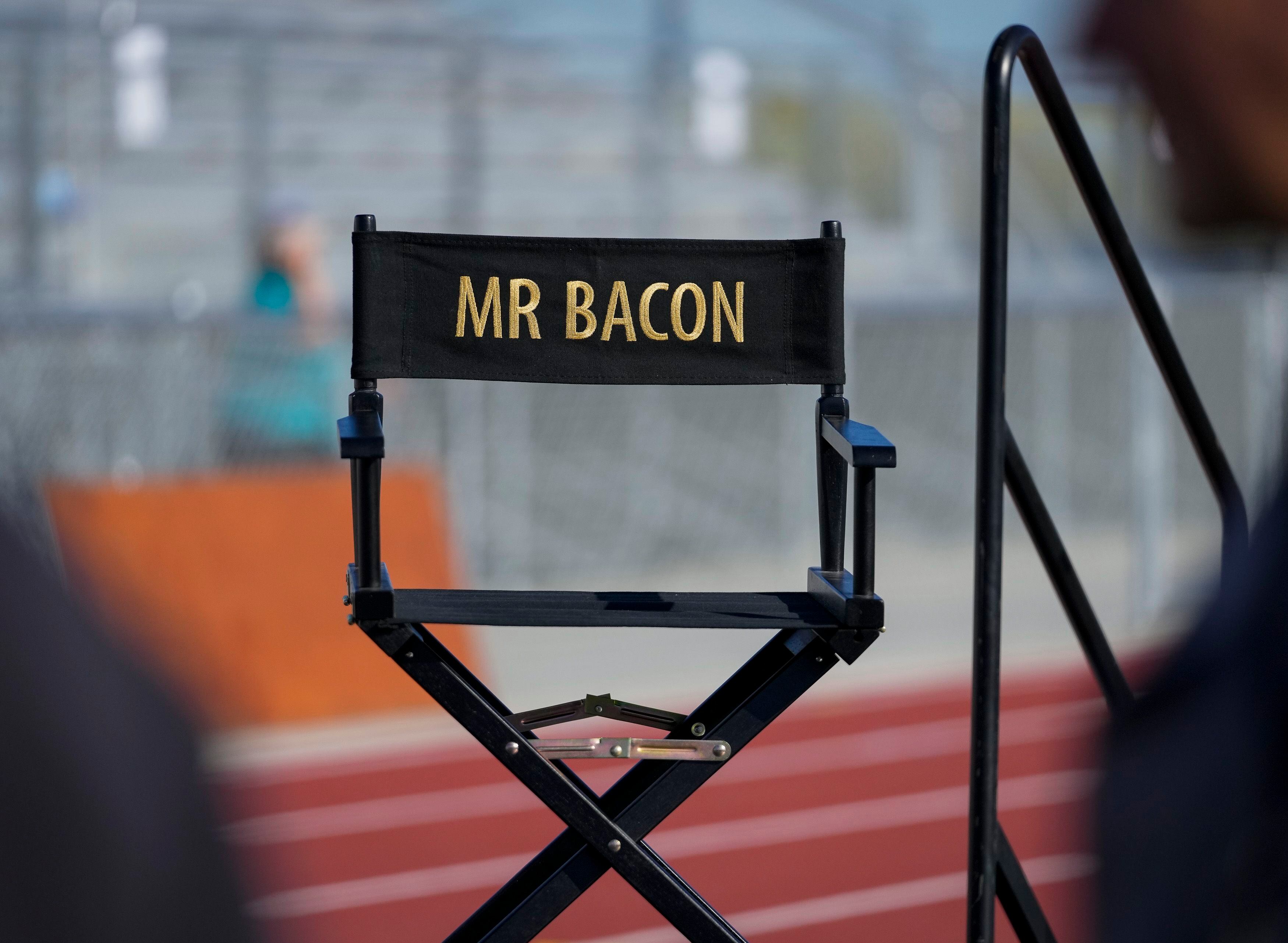 (Bethany Baker  |  The Salt Lake Tribune) A director's chair for Kevin Bacon sits on stage at a charity event to commemorate the 40th anniversary of the movie "Footloose" on the football field of Payson High School in Payson on Saturday, April 20, 2024.