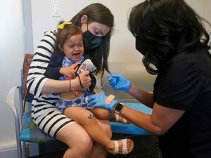 (Rick Bowmer | AP) Melissa Peng holds her daughter Abigail, 2, as she receives the Moderna COVID-19 vaccination Tuesday, June 21, 2022, in Salt Lake City. U.S. health officials have opened COVID-19 vaccines for infants, toddlers and preschoolers — the last group without the shots.