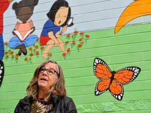 (Chris Samuels | The Salt Lake Tribune) Alison Schroeder looks upward as she speaks about a new mural and outdoor learning space at Riley Elementary School on Tuesday, Nov. 1, 2022. The mural and space were dedicated to her daughter Jessica Schroeder, a teacher who died of cancer in 2021.