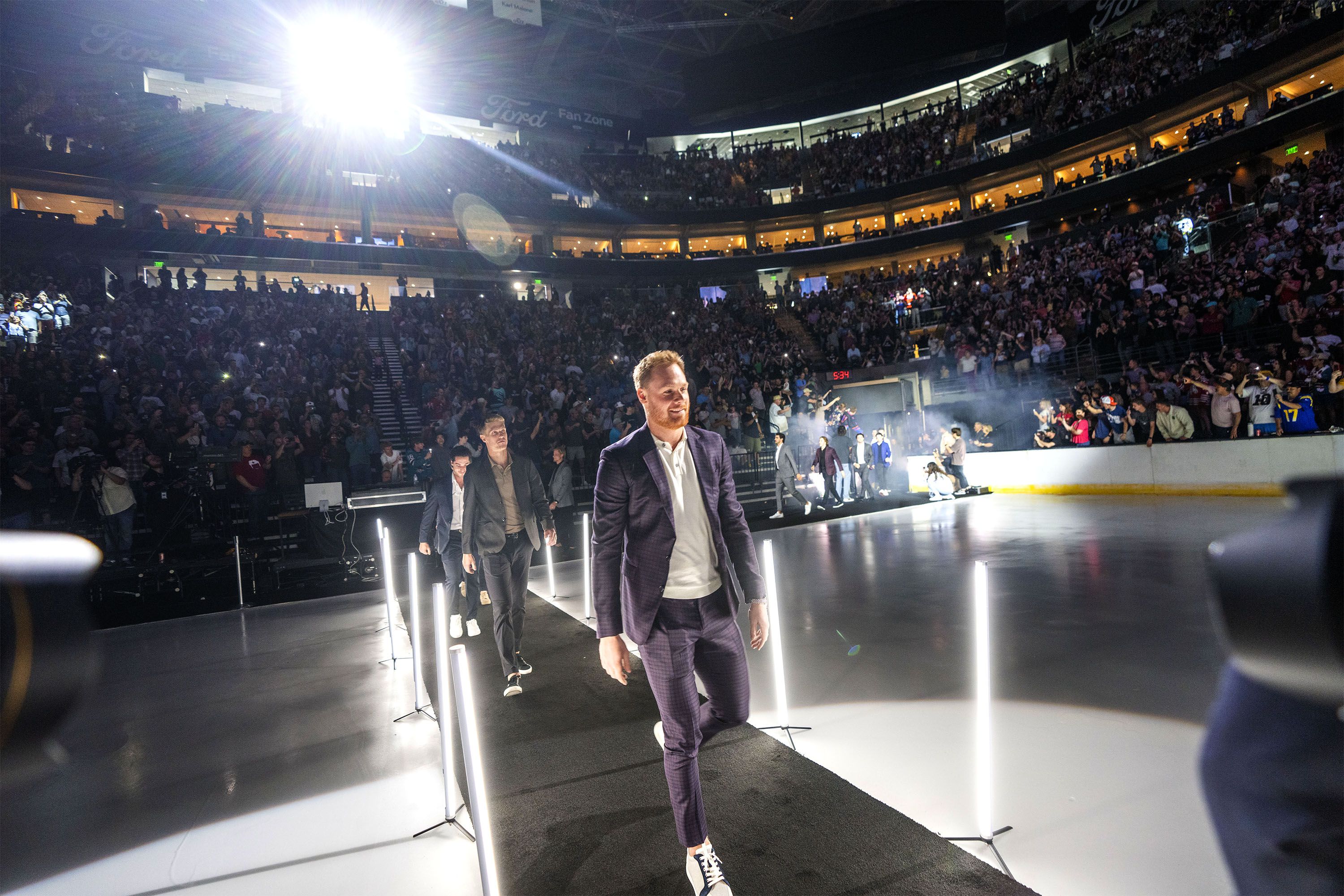 (Rick Egan | The Salt Lake Tribune) Players with the Utah NHL team enter the Delta Center at an event to celebrate Utah's new hockey franchise on Wednesday, April 24, 2024.