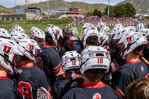(University of Utah) University of Utah men's lacrosse coach Drew McMinn huddles with his team during a game against the University of Detroit Mercy 
 on April 30, 2022 in Salt Lake City, Utah.