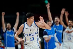 (Charlie Neibergall | AP) Italy's forward Simone Fontecchio (13) celebrates after making three point basket during men's basketball preliminary round game against Nigeria at the 2020 Summer Olympics, Saturday, July 31, 2021, in Saitama, Japan.