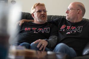 (Francisco Kjolseth | The Salt Lake Tribune) Rusty Davis-Clem, left, who was diagnosed with HIV about 35 years ago, is joined by his husband Mark, as they talk about their life on Friday, Nov. 26, 2021. As World AIDS Day approaches, 40 years since it was first diagnosed, Rusty reflects on the ravages of the AIDS pandemic and how he has lived to see the medical advancements made. He grew up in California, but now lives in the Salt Lake area.