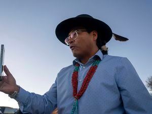 (William C. Weaver IV | AP) Buu Nygren, candidate for president of the Navajo Nation, speaks on a live stream via Facebook Live to his followers at the Tohatchi Chapter house in Tohatchi, N.M., Tuesday, Nov. 8, 2022.