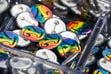(Rick Egan | The Salt Lake Tribune) Rainbow "Y" pins at a booth at Kiwanis Park, during Pride Night in Provo organized by BYU students, on Saturday, Sept. 4, 2021. There's a new social media movement to support LGBTQ students at the private Utah school owned by The Church of Jesus Christ of Latter-day Saints in June 2022.