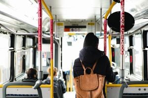 (Rachel Rydalch | The Salt Lake Tribune)  A woman rides a UTA public transit bus in Salt Lake City on Tuesday, Feb. 22, 2022.