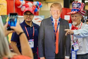 (Cooper Neill | The New York Times)

Cruz Majeno and Duane Schwingel pose for a photo with a cardboard cutout of former President Donald Trump, at the Conservative Political Action Conference (CPAC) in Dallas on Saturday, July 10, 2021.