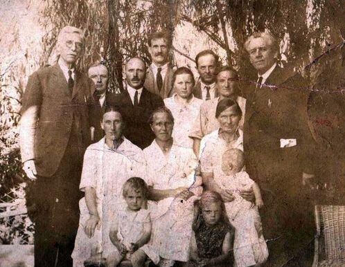 (FamilySearch) Herta Klara Kullick, the only teenager in this group photo, helped boost the success Latter-day Saint missionary work in Argentina by learning how to speak Spanish. The man on left, with white mustache, is Rulon S. Wells of the then-First Council of Seventy; the man on the right with the paper in his jacket pocket is apostle Melvin J. Ballard. The balding man standing next to Herta is her father, Jacob Kullick; her mother, Anna Biebersdorf Kullick, is seated at the left in the row of women (her hair is parted in the middle).