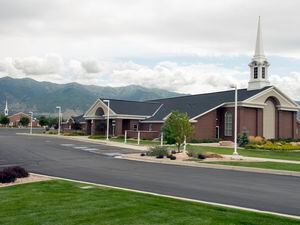 (Rick Egan | The Salt Lake Tribune) This 2014 photo shows two Latter-day Saint meetinghouses in Kaysville. Church leaders are encouraging those who see overwatering at the faith's buildings to report it.