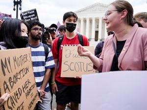 (AP Photo/Jacquelyn Martin) Abortion-rights activists, at left, confront anti-abortion activists, at right, react following Supreme Court's decision to overturn Roe v. Wade in Washington, Friday, June 24, 2022. The Supreme Court has ended constitutional protections for abortion that had been in place nearly 50 years, a decision by its conservative majority to overturn the court's landmark abortion cases.