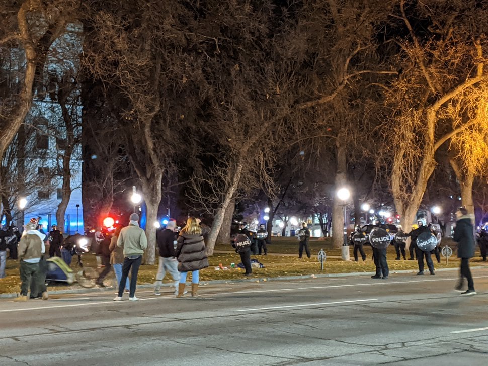 (Paighten Harkins | The Salt Lake Tribune) Protesters and onlookers watch as Salt Lake City police move in on a group of protesters occupying Washington Square Park on Sunday, Jan. 5, 2020.