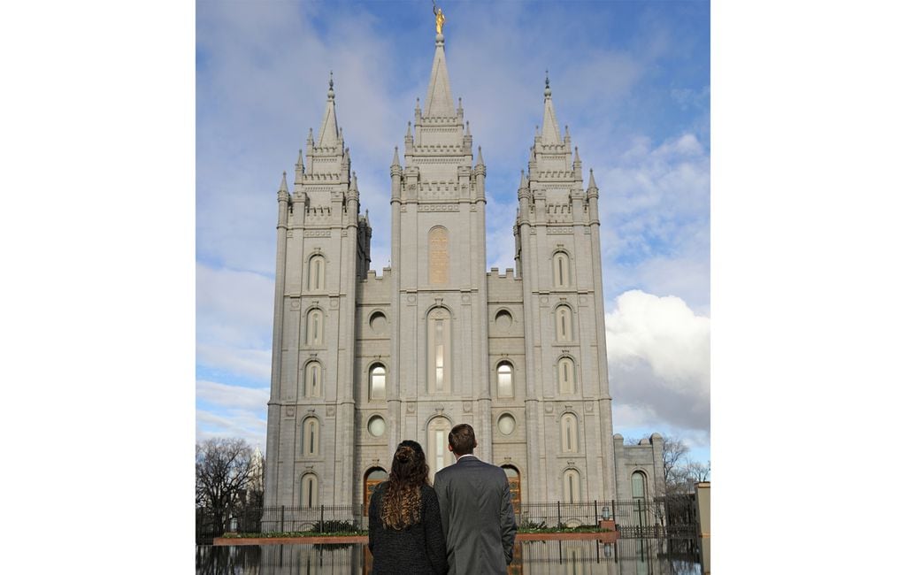(Rick Bowmer | AP) A couple look at the Salt Lake Temple, April 6, 2019. The Church of Jesus Christ of Latter-day Saints voiced its support for the federal Respect for Marriage Act, which recognizes legally sanctioned same-sex marriage, as long as it safeguards religious freedoms.