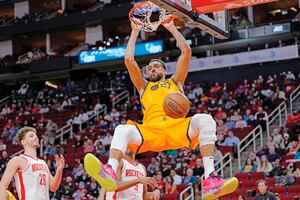 Utah Jazz's Rudy Gobert dunks the ball against the Houston Rockets during the second half of an NBA basketball game Wednesday, March 2, 2022, in Houston. The Jazz won 132-127 in overtime. (AP Photo/David J. Phillip)