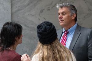(Francisco Kjolseth | The Salt Lake Tribune) Rep. Phil Lyman, R-Blanding, speaking with Sophie Anderson and Jen Orten, known as "Two Red Pills" on social media, at the Utah State Capitol.