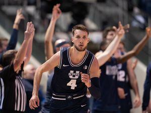 (Francisco Kjolseth | The Salt Lake Tribune) Utah State Aggies forward Brandon Horvath scores against the Brigham Young Cougars on Wednesday, Dec. 8, 2021. Horvath's double-double on Wednesday helped USU beat Air Force to open the Mountain West Conference tournament in Las Vegas.