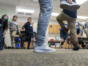 (Leah Hogsten | The Salt Lake Tribune) Guadalupe School music teacher Kimberly Marsden teaches her students the Schuhplattler dance from Germany, April 6, 2022. The school has received a grant that will help families in the community upgrade the energy-efficiency of their homes.