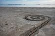 (Leah Hogsten | The Salt Lake Tribune)  People explore the Spiral Jetty, just south of the Rozel Point peninsula on the northeastern shore, March 25, 2022. 