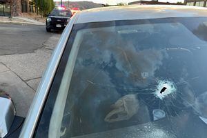 (Salt Lake City Police Department) The hole in the windshield of a car is believed to have been from a bullet fired during an altercation near Major Street in Salt Lake City that sent one man to the hospital in critical condition Sunday, July 3, 2022.