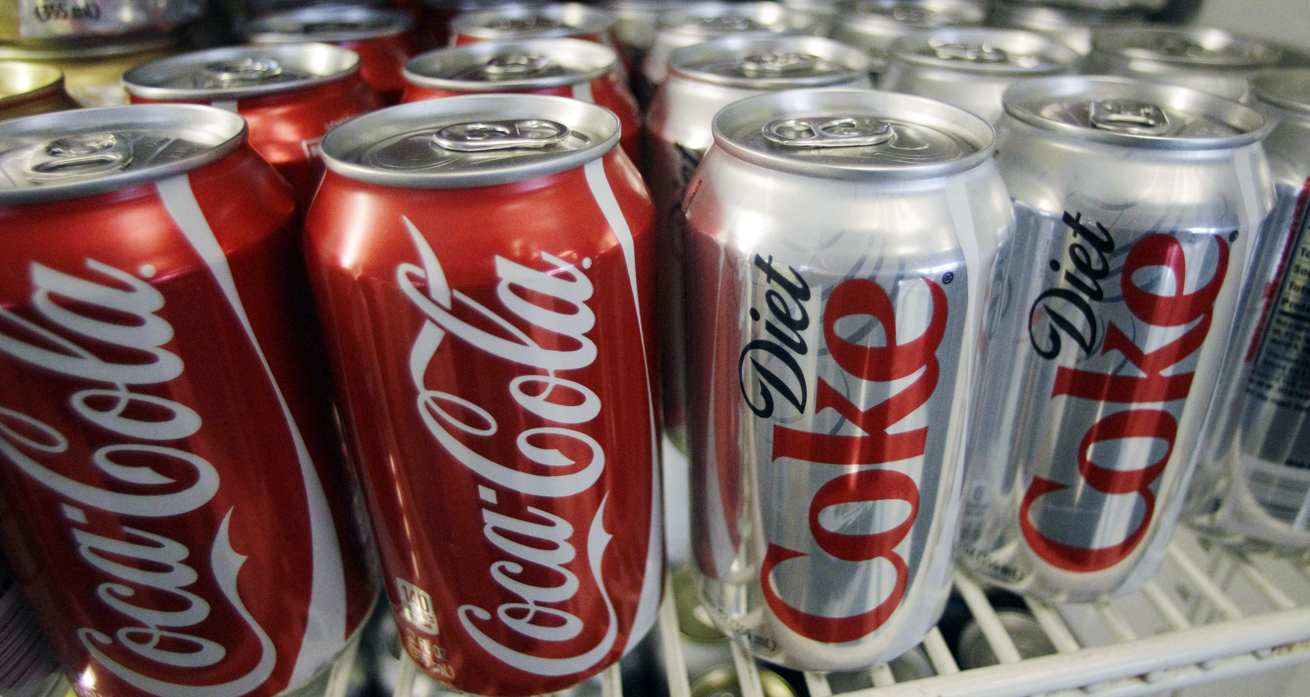 (AP file photo) Can of Coca-Cola and Diet Coke are shown in 2011 in Portland, Ore. Unlike want many church outsiders and some insiders think, Latter-day Saints can drink caffeinated colas.