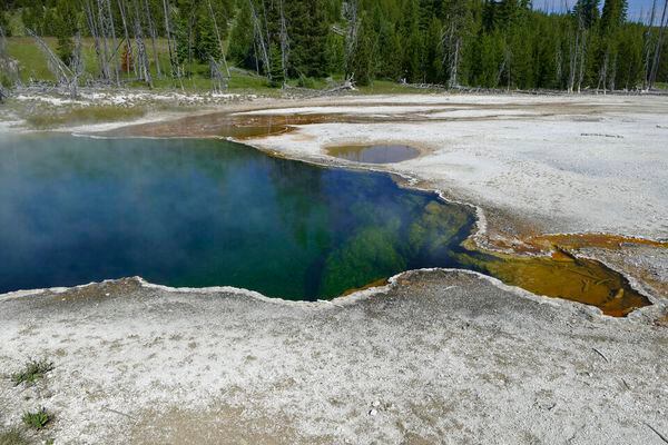 (Diane Renkin | National Park Service via AP) In this photo provided by the National Park Service is the Abyss Pool hot spring in the southern part of Yellowstone National Park, Wyo., in June 2015. Park officials say part of a foot, in a shoe, found floating in the hot spring on Tuesday, Aug. 16, 2022, is related to a July 31, 2022 death. No foul play is suspected, but the investigation continues.