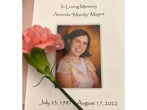 (Office of the Lt. Gov.) A funeral program for Amanda Mayne, who was killed by her ex-husband in August. Lt. Gov. Deidre Henderson was Mayne's cousin. Sen. Todd Weiler plans to introduce a bill to create a state database of domestic violence-related calls to law enforcement.