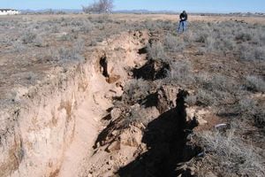 (Utah Geological Survey) An earth fissure caused by flooding in 2005 near Beryl Junction, in the Escalante Valley in Iron County.
