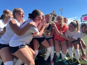 (Alex Vejar | The Salt Lake Tribune) The Davis High School girls' soccer team celebrates after winning the 6A state title in a 1-0 game over Farmington on Saturday, Oct. 21, 2022 at Zions Bank Stadium in Herriman.