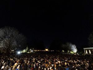 (Mike Kropf/The Daily Progress via AP) Students participate in a vigil in response to shootings that happened on the University of Virginia campus the night before in Charlottesville, Va., on Monday, Nov. 14, 2022.