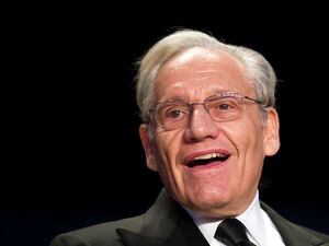 FILE - In this April 29, 2017, file photo journalist Bob Woodward sits at the head table during the White House Correspondents' Dinner in Washington. (AP Photo/Cliff Owen, File)
