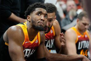 (Francisco Kjolseth | The Salt Lake Tribune) Utah Jazz guard Donovan Mitchell (45) listens to Utah Jazz center Rudy Gobert (27) during a time out during Game 3 of an NBA basketball first-round playoff series against the Dallas Mavericks, Thursday, April 21, 2022, in Salt Lake City.