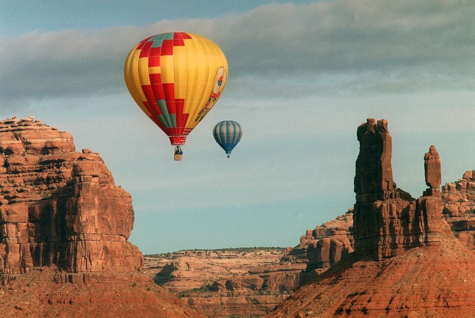 (Al Hartmann | The Salt Lake Tribune) Hot air balloons hover over formation in Valley of the Gods an area between Bluff and Mexican Hat. The area was part of Bears Ears National Monument.