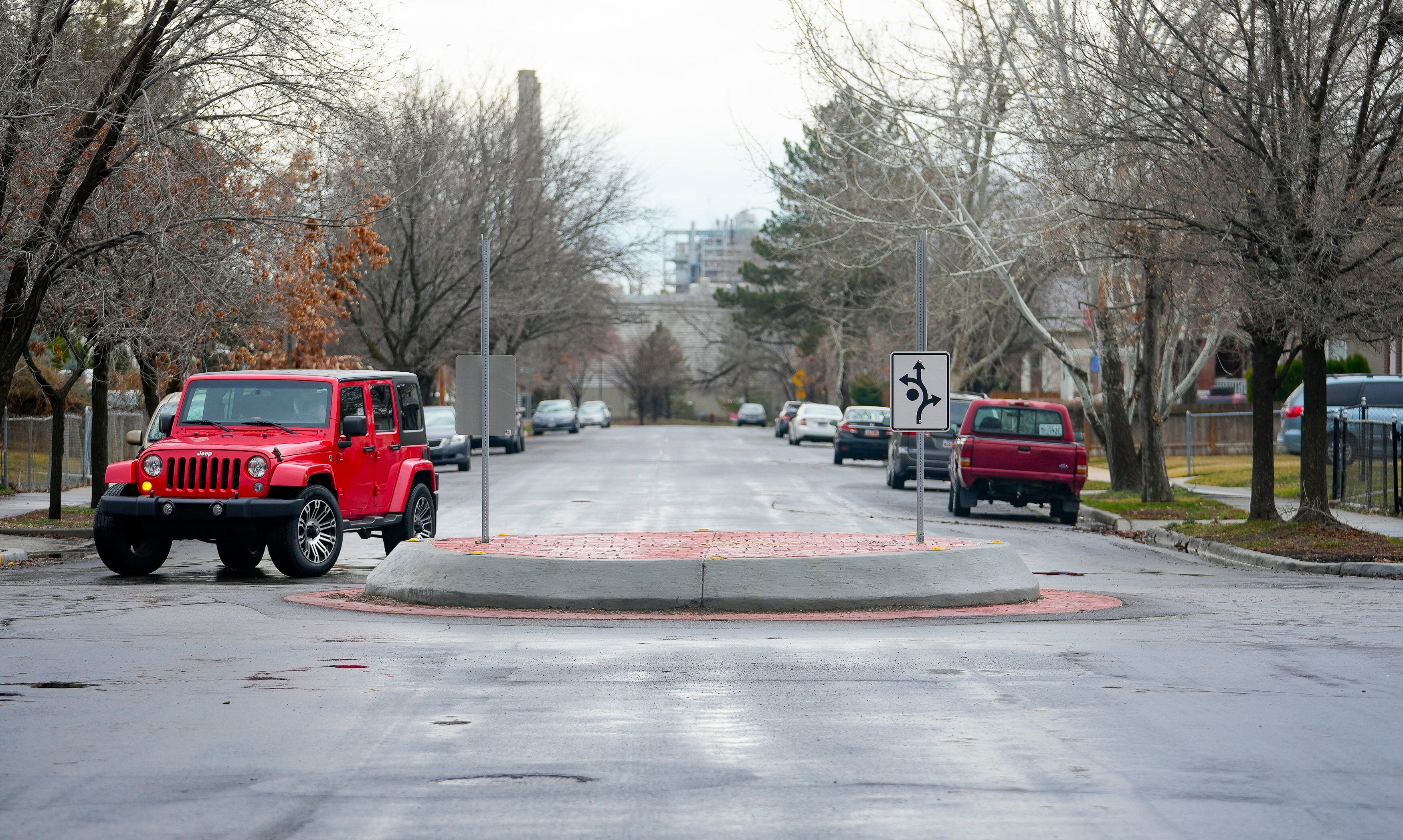 (Bethany Baker | The Salt Lake Tribune) A Jeep drives through a roundabout at the intersection of 500 North and 1300 West in Salt Lake City on Tuesday, Feb. 20, 2024.