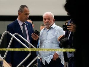 (Eraldo Peres | AP) Brazil's President Luiz Inacio Lula da Silva walks in Planalto Palace after it was stormed by supporters of Brazil's former President Jair Bolsonaro in Brasilia, Brazil, Sunday, Jan. 8, 2023.