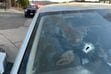 (Salt Lake City Police Department) The hole in the windshield of a car is believed to have been from a bullet fired during an altercation near Major Street in Salt Lake City that sent one man to the hospital Sunday, July 3, 2022. Police have made two arrests in the shooting.